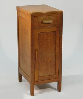 Appraisal: A Heal's oak bedside cupboard simple form applied Heal's label