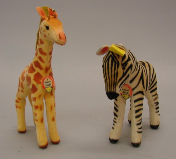 Appraisal: Pair of velveteen wild animals Apricot Giraffe with airbrushed spots