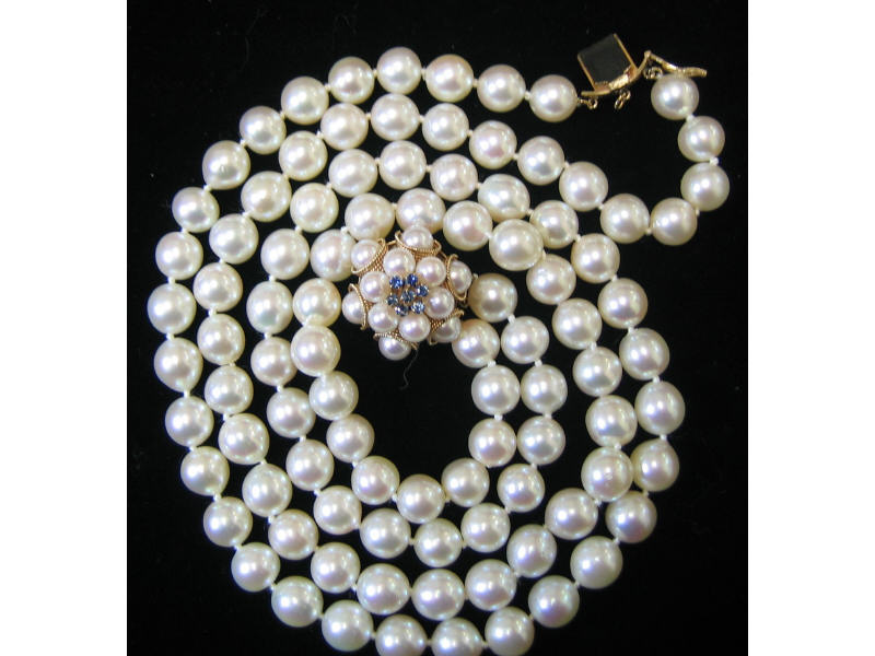 Appraisal: DOUBLE STRAND CULTURED PEARLS - mm pearls with light cream