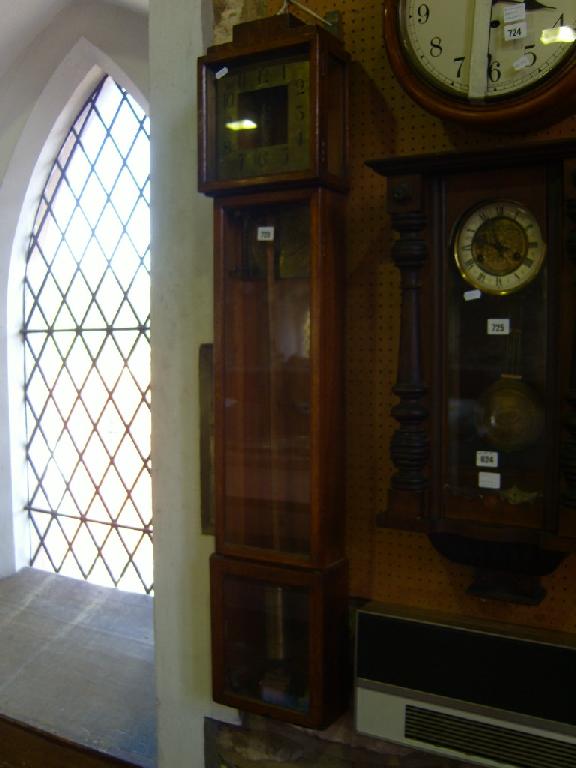 Appraisal: An Art Deco electric wall clock dismantled the oak case