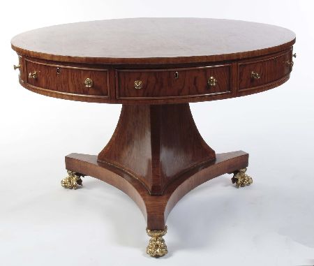 Appraisal: A figured walnut and crossbanded library drum table In the