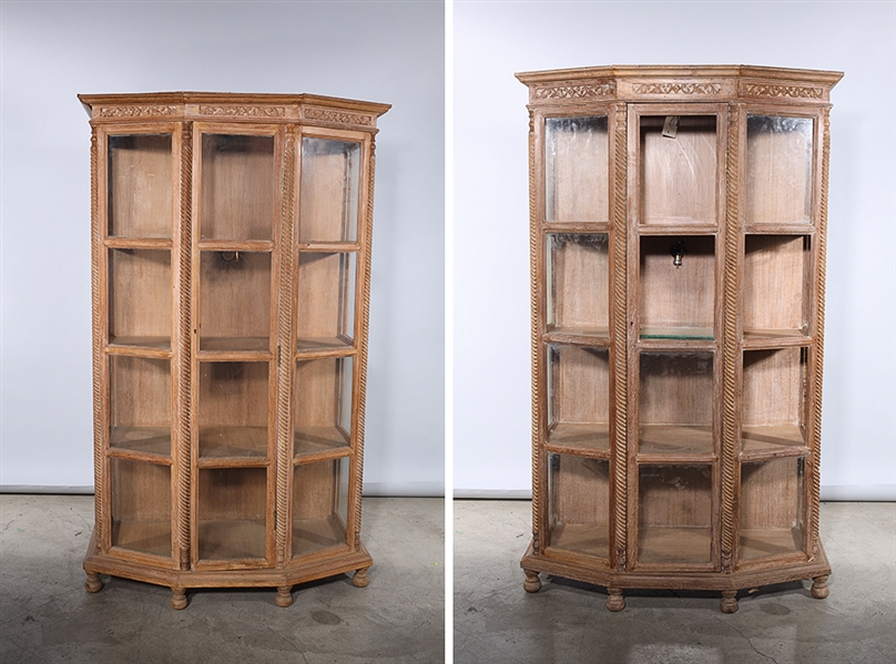 Appraisal: Two carved wooden display cabinets with glass panels some wear