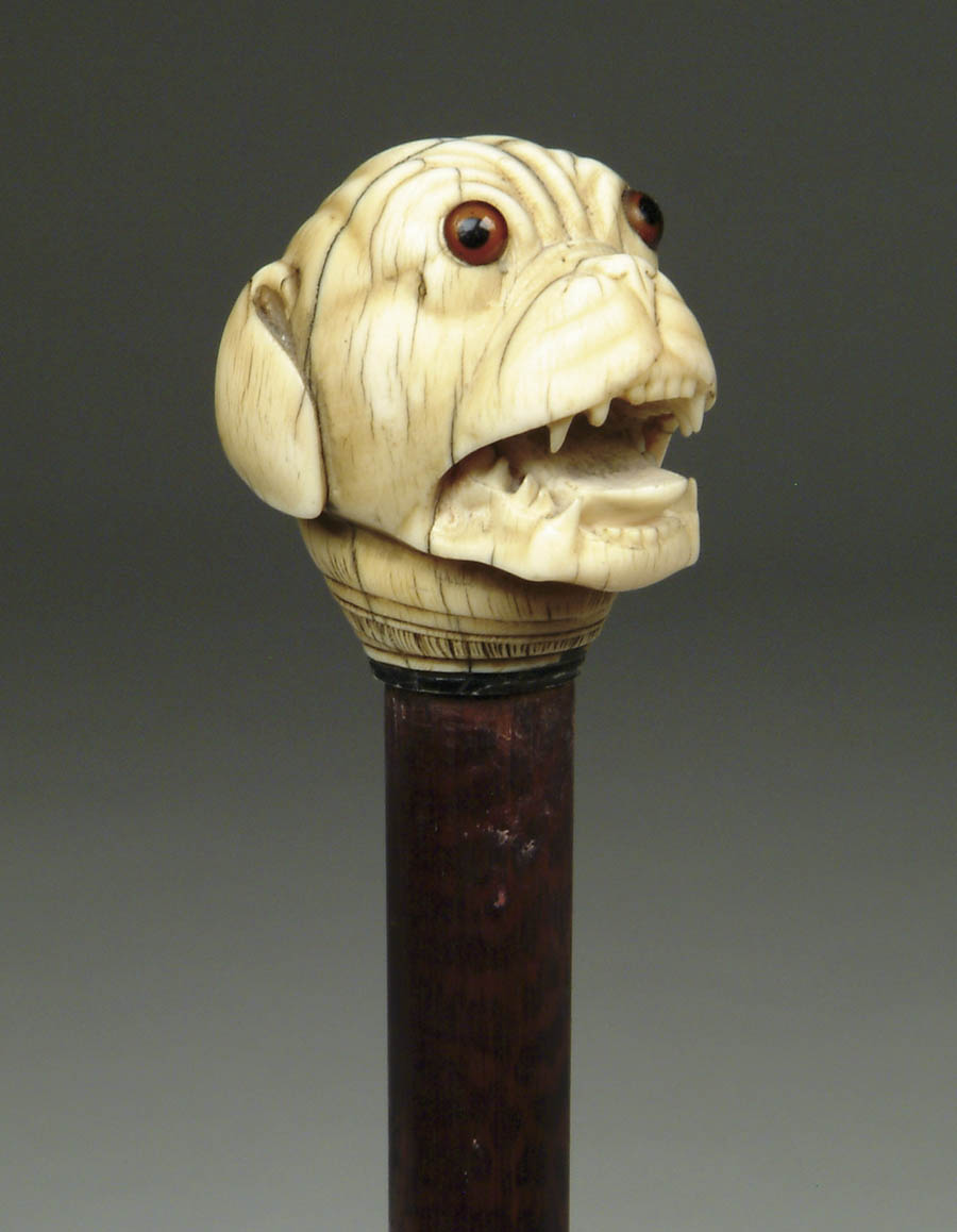 Appraisal: CARVED IVORY CANE WITH MASTIFF Carved mastiff head has brown