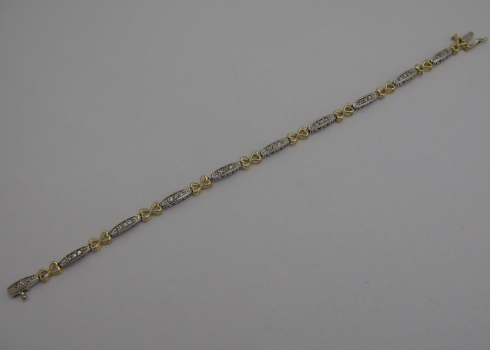 Appraisal: DIAMOND AND KARAT WHITE AND YELLOW GOLD BRACELET - in