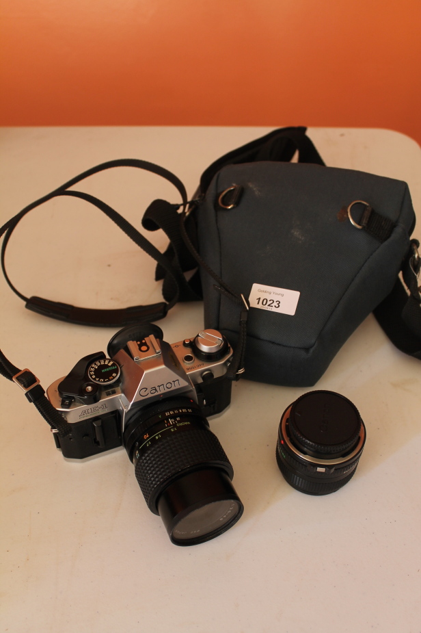 Appraisal: A Canon AE- N SLR camera with additional lens and