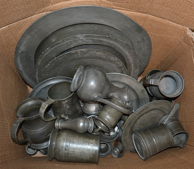 Appraisal: A collection of pewterprincipally th Centuryto include various chargers tankards