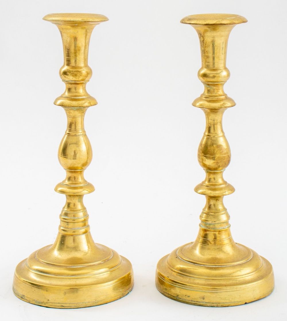 Appraisal: BAROQUE MANNER BRASS CANDLESTICKS PAIR Pair of Baroque manner brass