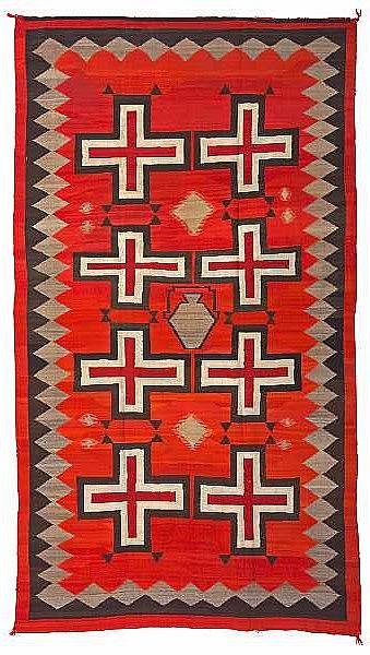 Appraisal: A large Navajo rug Softly woven aligning two rows of