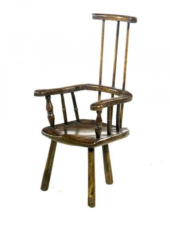 Appraisal: AN ASH WINDSOR COMB BACK CHILD'S CHAIR with shaped armbow