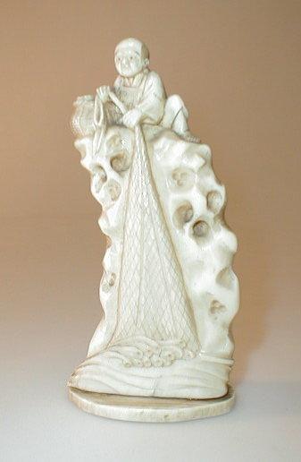 Appraisal: A Japanese ivory okimono figure depicting a fisherman trailing his