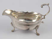 Appraisal: A Georgian silver cream boat on hoof feet with flying