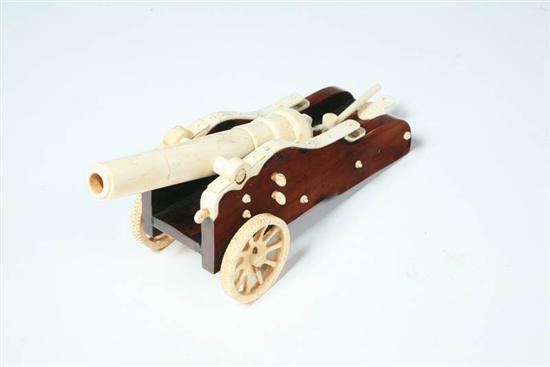 Appraisal: FOLK ART CANNON Bone and softwood Well carved and resting