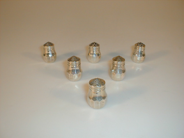 Appraisal: Six white metal small pepperettes of panelled baluster form stamped