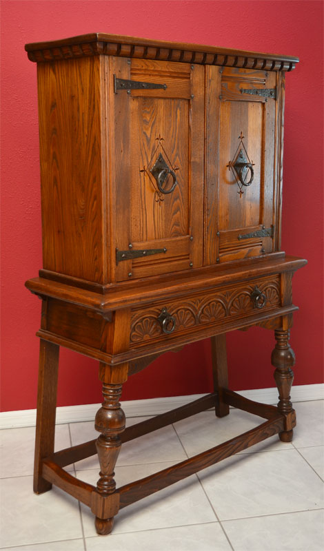 Appraisal: ENGLISH OAK BLIND CHINA CABINET Dentil molding over carved doors