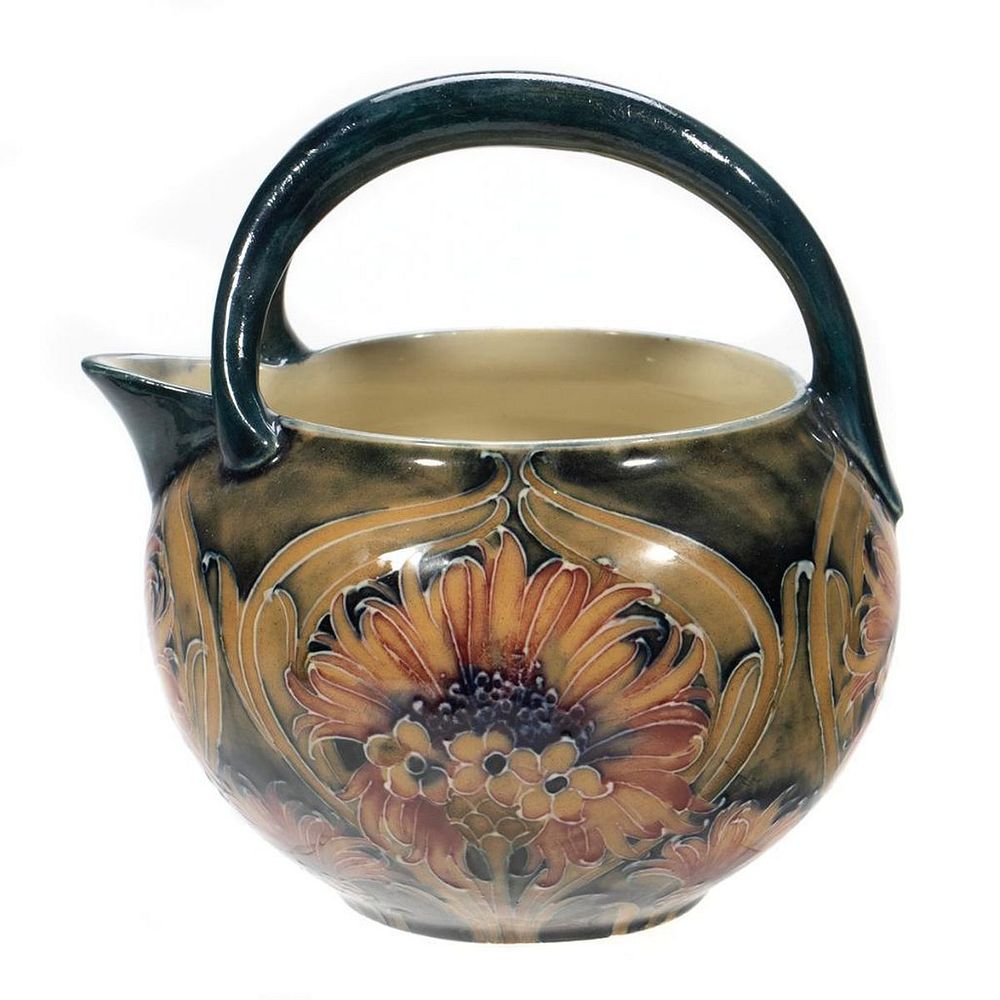 Appraisal: Moorcroft Pottery Creamer Decorated with Daisy and Poppy design Underglaze