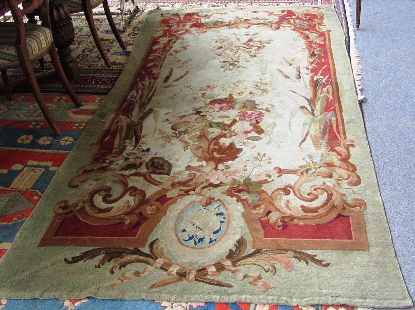 Appraisal: A European rug panel the ivory field with a large