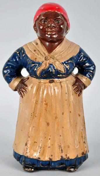 Appraisal: Cast Iron Thin Waist Mammy Doorstop Description Number on back