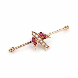 Appraisal: A ct gold seed pearl and ruby set swallow brooch