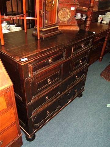 Appraisal: A Jacobean oak chest of two short and three long