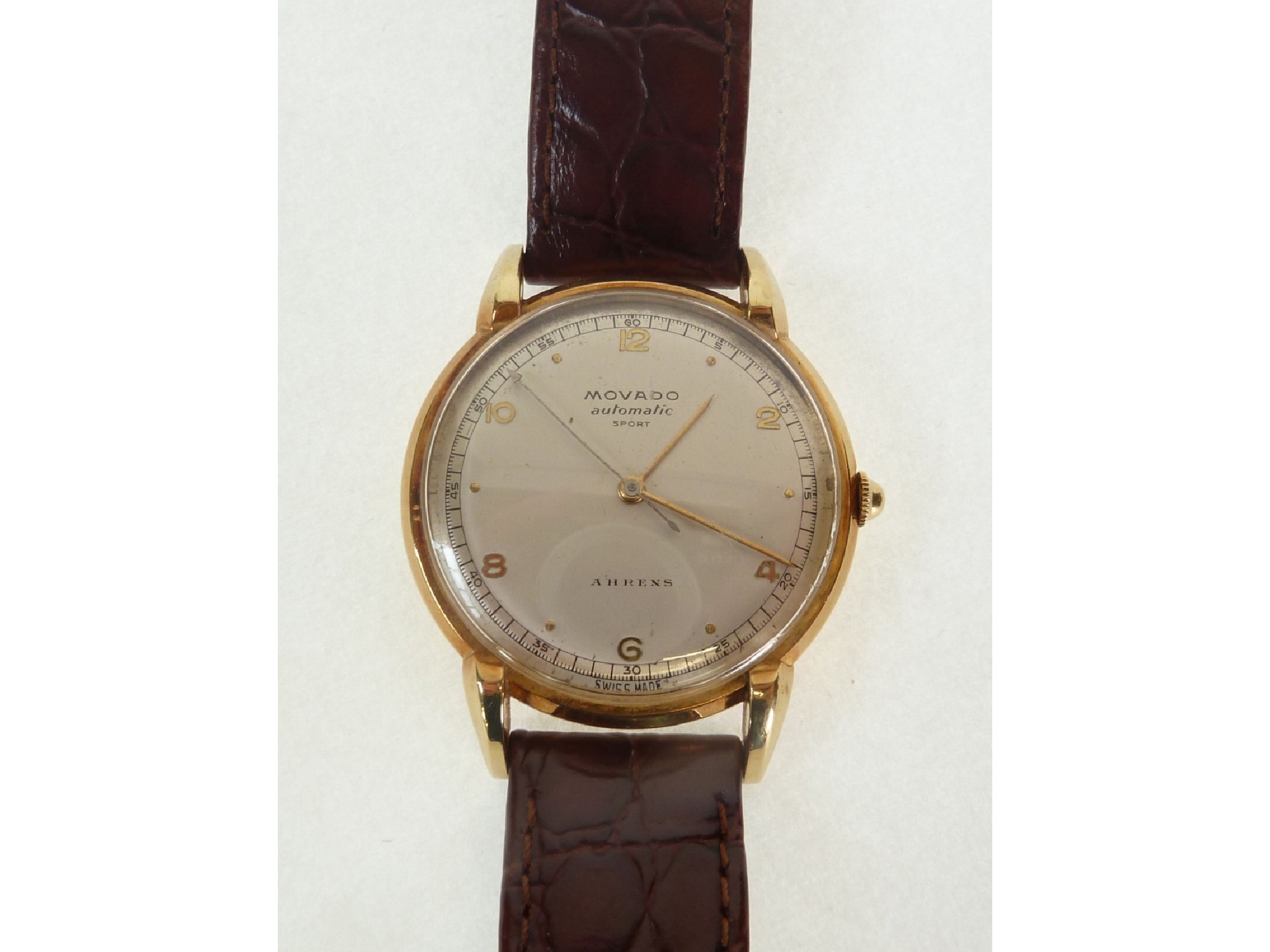 Appraisal: A GOLD CASED MOVADO SPORT AHRENS WRIST WATCH automatic movement