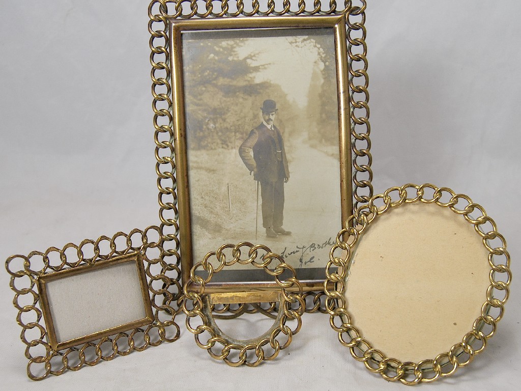 Appraisal: Four brass chainlink photograph frames