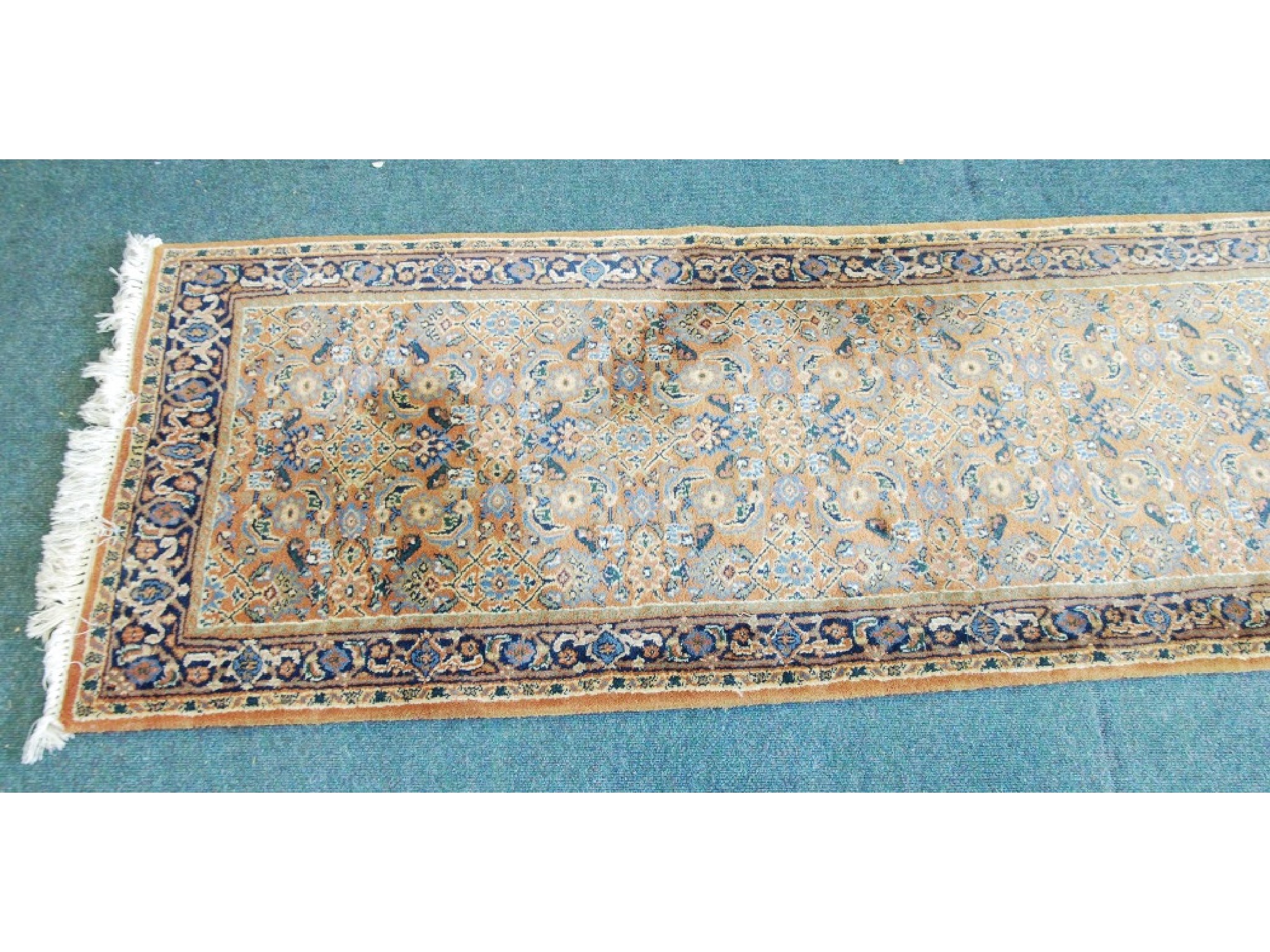 Appraisal: PERSIAN RUNNER with all over herati formal floral pattern on