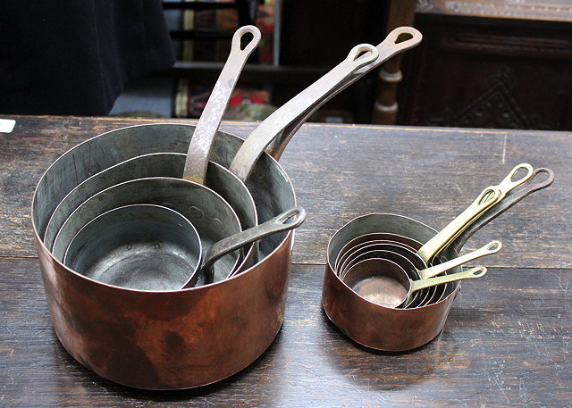 Appraisal: A GROUP OF TEN COPPER SAUCEPANS the smallest cm diameter