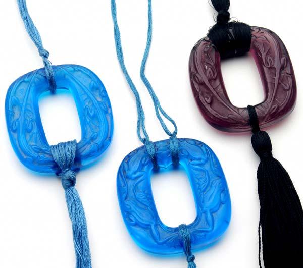 Appraisal: RENE LALIQUE Three pendants two Lezards of electric blue and