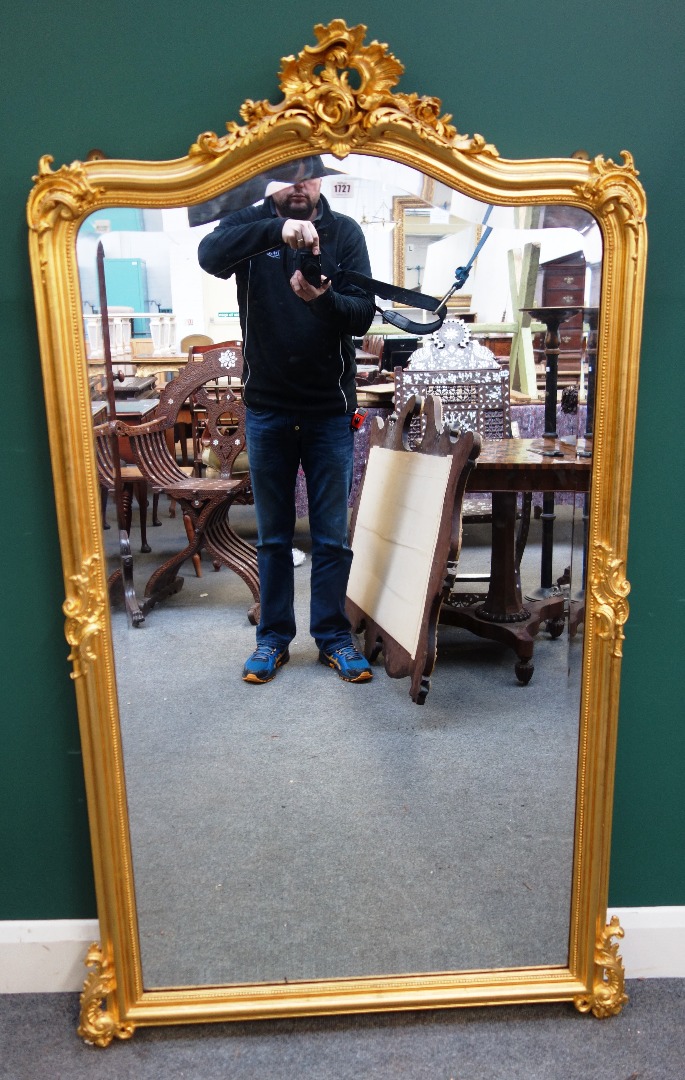 Appraisal: A late th century gilt framed mirror with pierced scroll