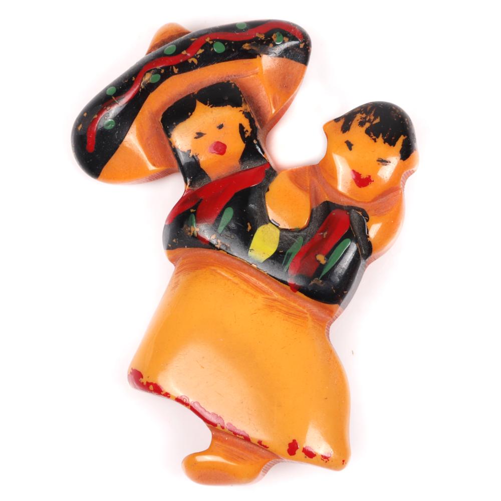 Appraisal: VINTAGE BAKELITE PAINTED FIGURAL MEXICAN WOMAN IN SOMBRERO WITH CHILD