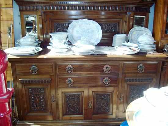 Appraisal: A MID VICTORIAN FOUR DRAWER AND FOUR DOOR MAHOGANY SIDEBOARD