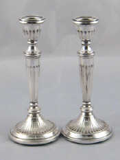 Appraisal: A pair of silver candlesticks import marks for London Ht