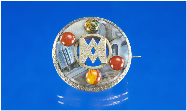 Appraisal: A Scottish Hardstone Brooch centred with a stylised monogram in