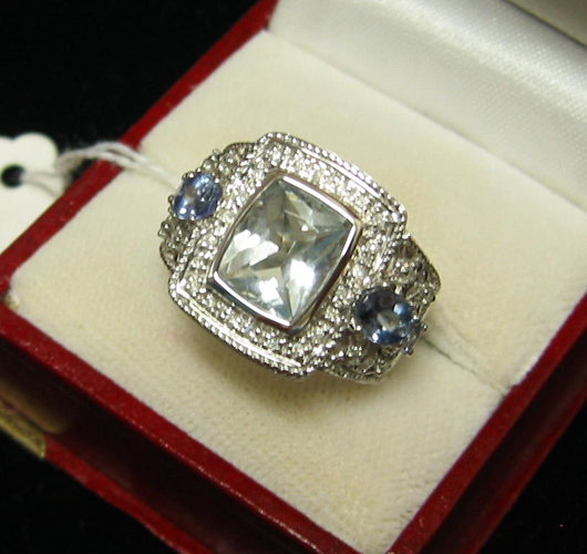 Appraisal: AQUAMARINE TANZANITE DIAMOND AND FOURTEEN KARAT WHITE GOLD RING centered