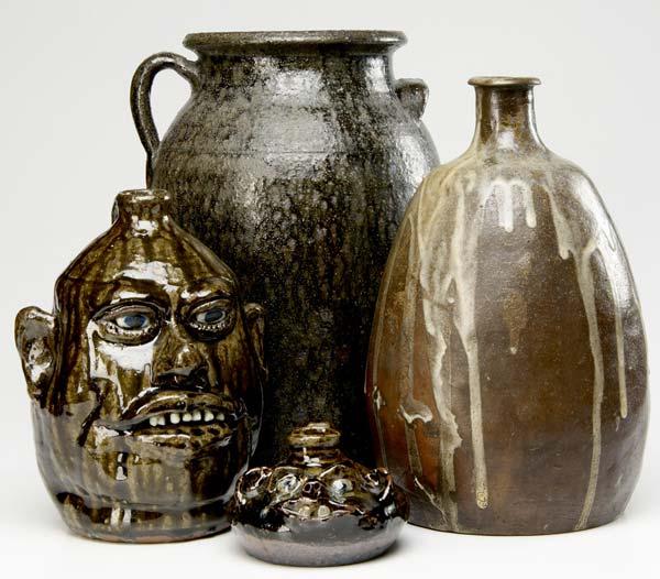 Appraisal: NORTH CAROLINA POTTERY Four pieces Lanier Meaders face jug Mary