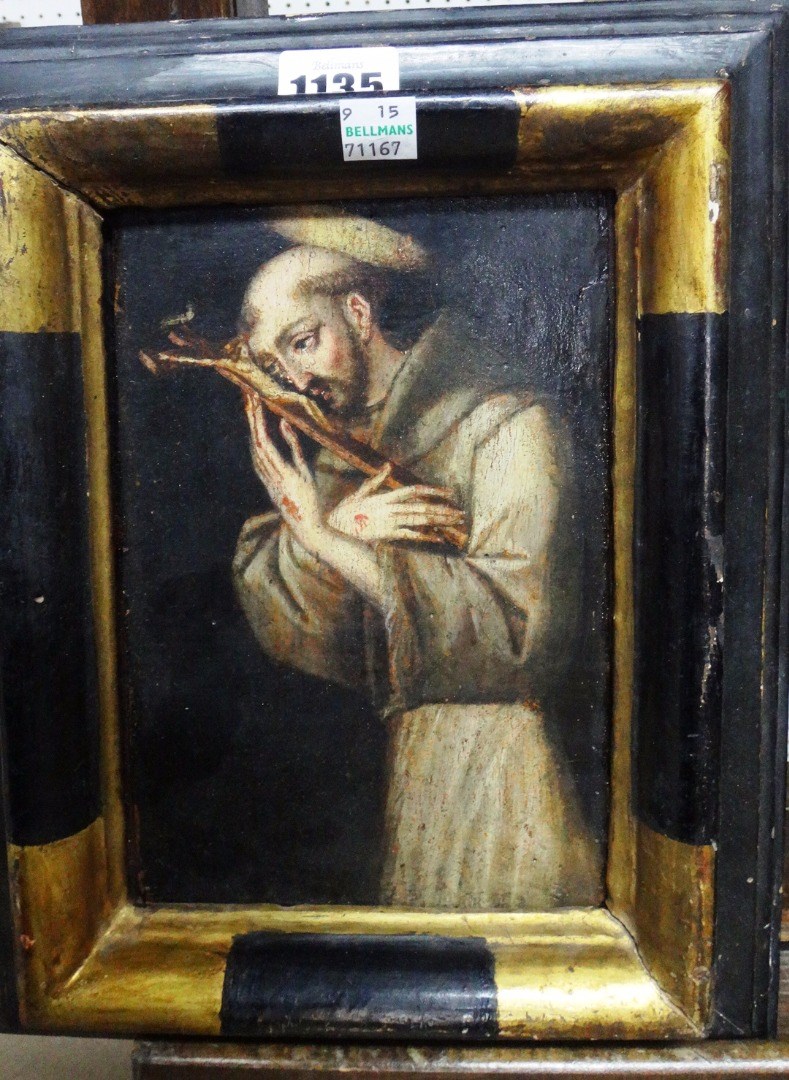 Appraisal: Northern European School Saint Francis adoring the cross oil on