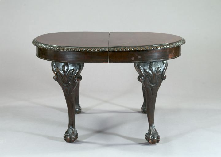 Appraisal: English Carved Mahogany Elliptical Extension Dining Table in the Chippendale