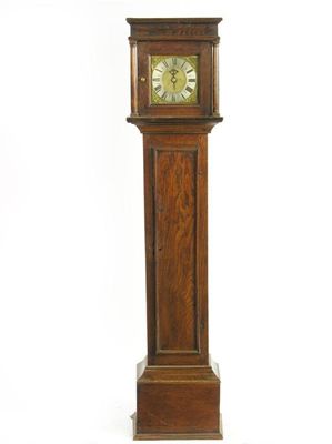 Appraisal: A small oak longcase clock the hour bird cage movement