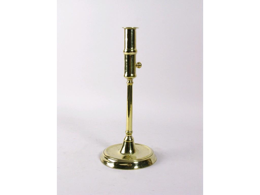 Appraisal: A late th Century side-ejector brass Candlestick on circular base