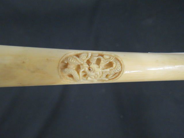 Appraisal: Victorian Carved Ivory Handled Walking Stick intaglio dragon ring ball