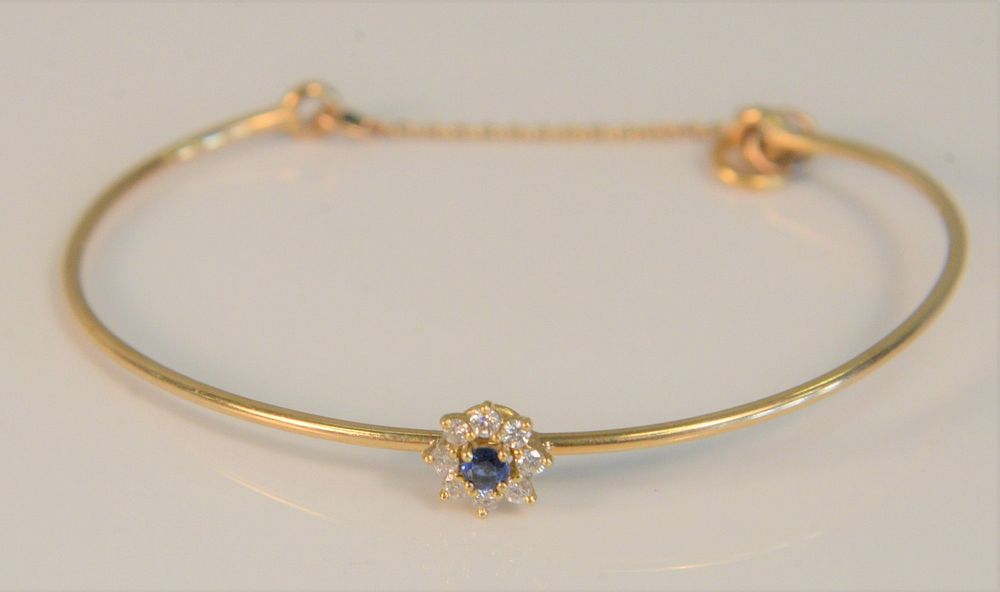 Appraisal: K bracelet set with blue stone surrounded by eight diamonds