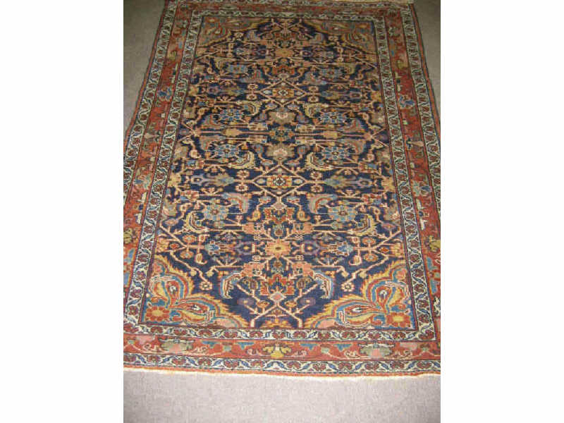 Appraisal: HAMADAN THROW RUG The indigo angular floral herati field cornered