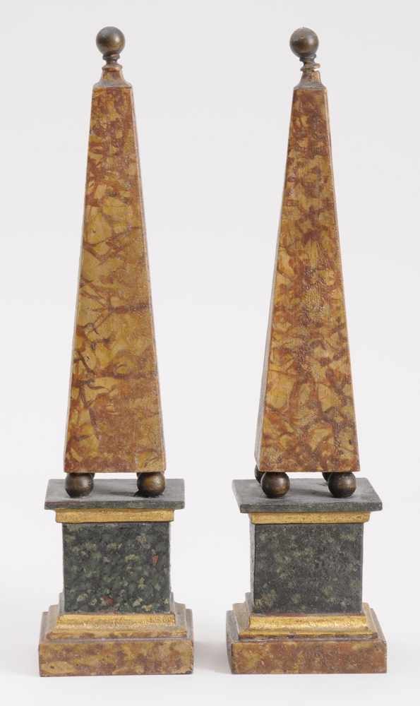 Appraisal: PAIR OF MARBELIZED T LE PEINTE OBELISKS Each tapered stem