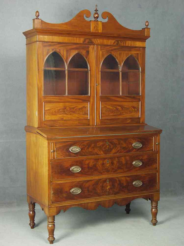 Appraisal: SECRETARY - Two part mahogany Sheraton period secretary double scroll