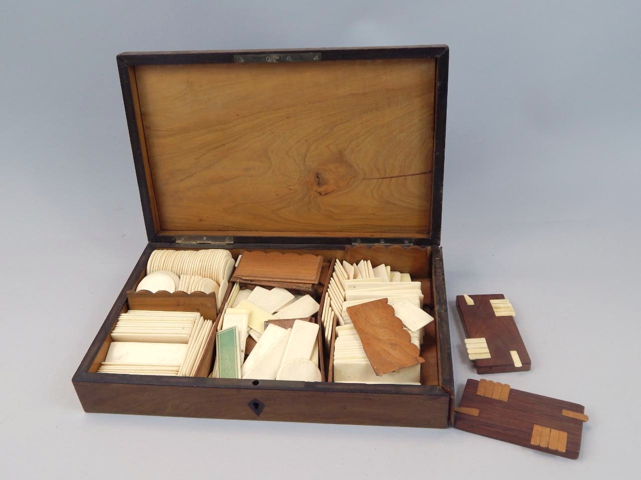 Appraisal: A thC marquetry and inlaid games box the rectangular lid