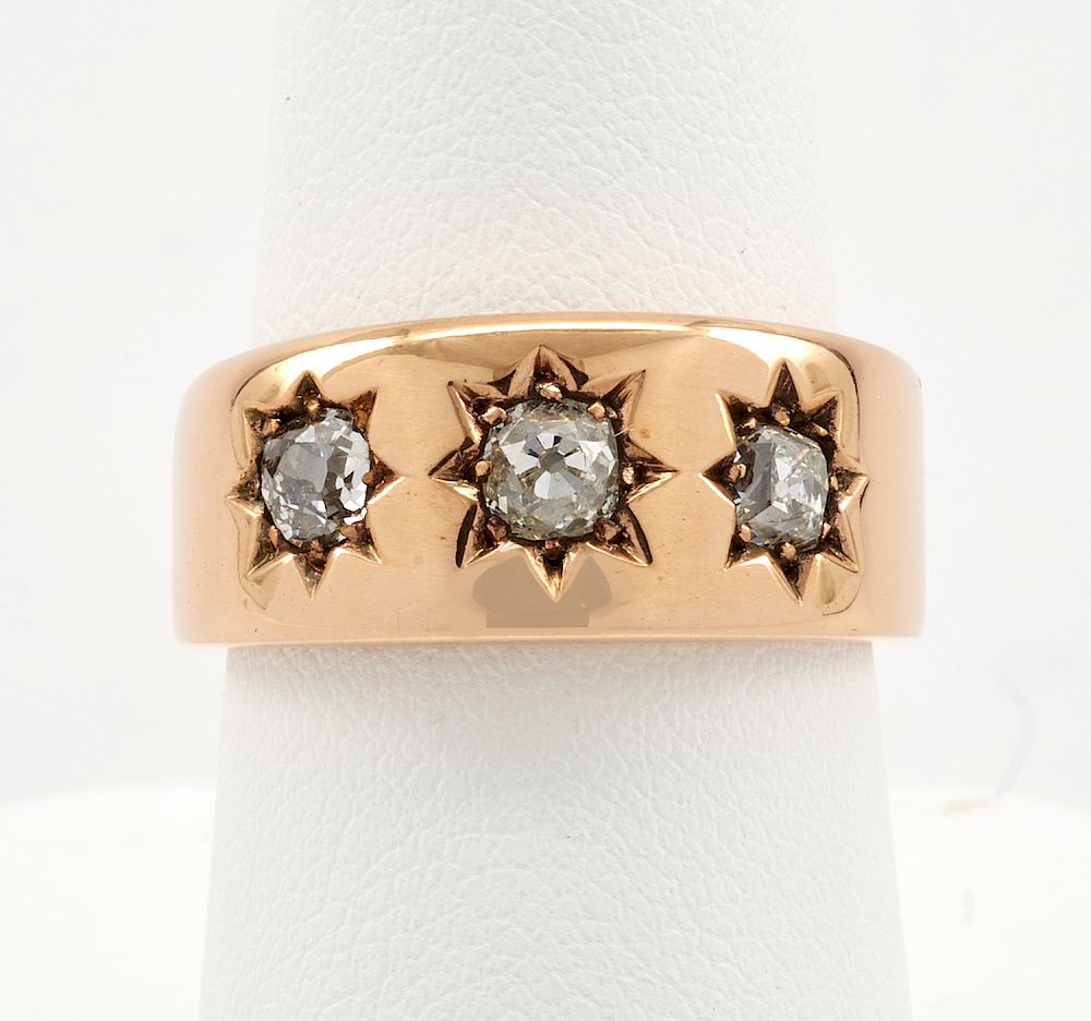 Appraisal: k Rose gold ring band with three star set diamonds