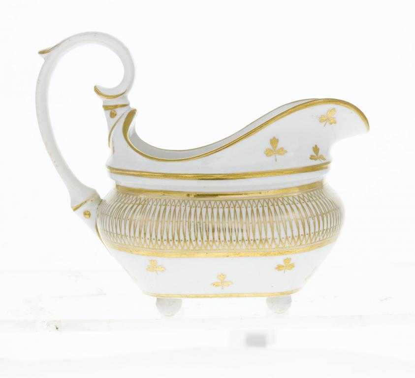 Appraisal: A DERBY SILVER SHAPED CREAM JUG gilt with sprigs and