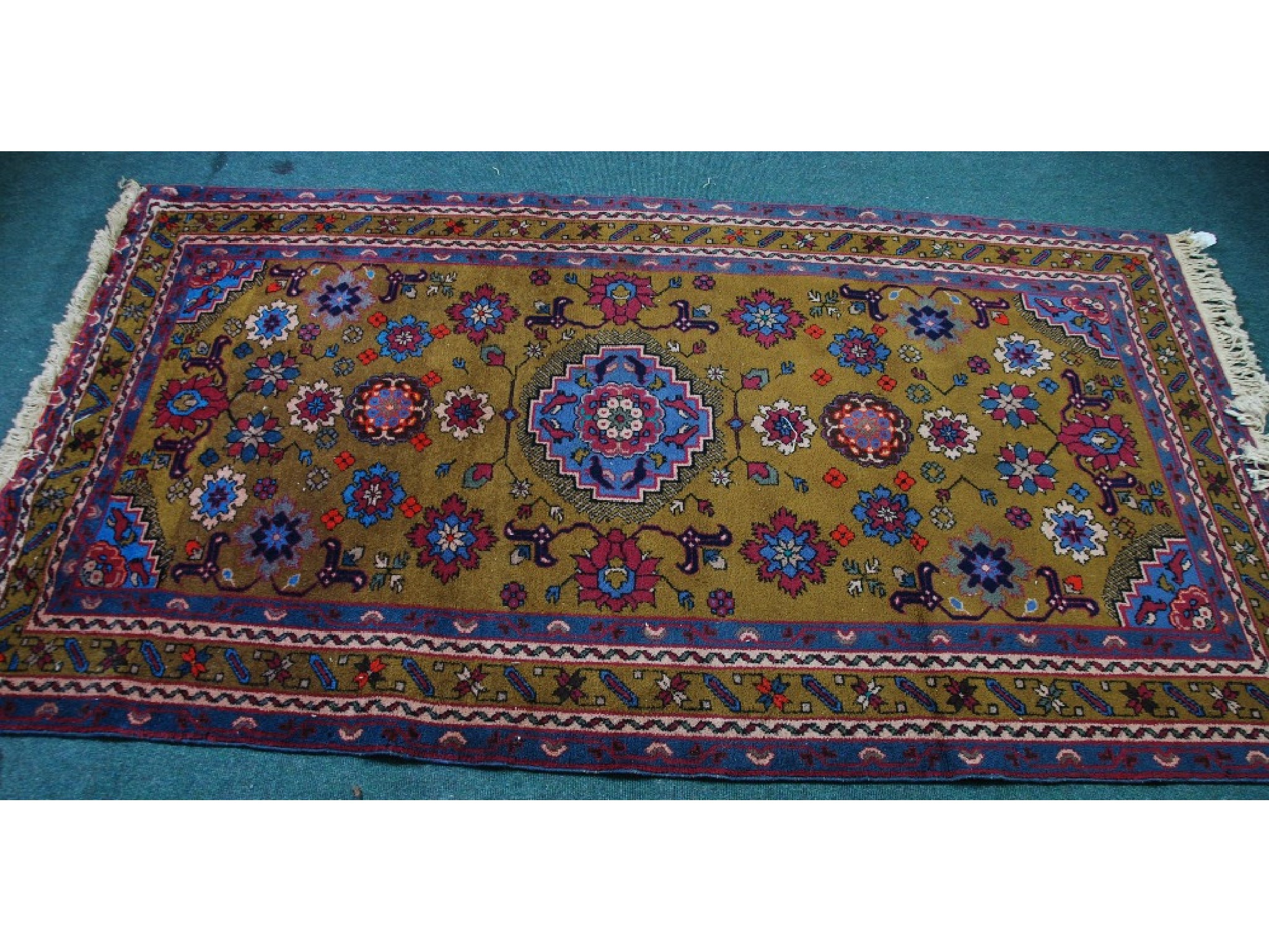 Appraisal: LARGE EASTERN RUG with pale blue and centre medallion with