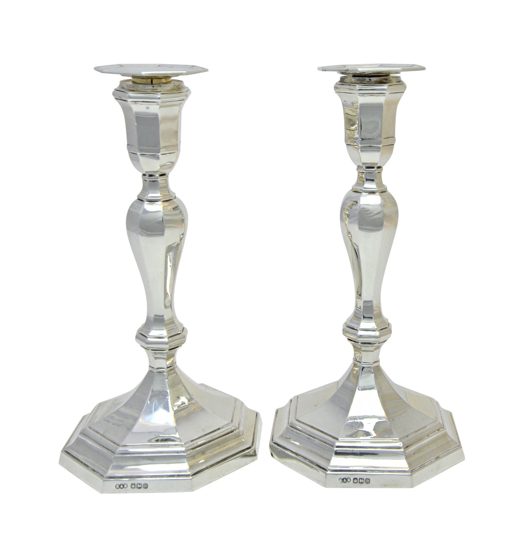 Appraisal: A pair of silver table candlesticks each with an octagonal