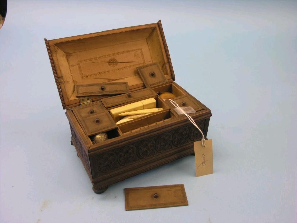 Appraisal: A th century carved sandalwood work box containing a collection